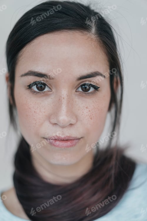 Preview: Portrait of a young woman wearing her ponytail wrapped around her neck