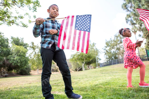 Preview: Children playing with American flag in park