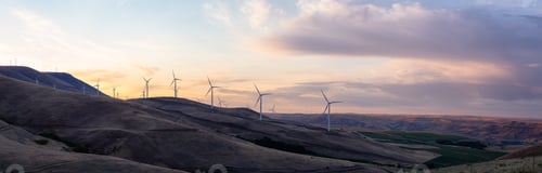 Preview: View of Wind Turbines on a Windy Hill during a colorful sunrise