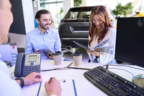 Preview: Buyers choosing new motorcar model from automotive brochures