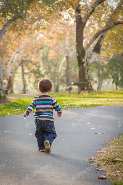Preview: Happy Young Baby Boy Walking in the Park.