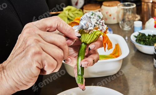Preview: Chef fills zucchini flowers with parmesan cheese or zucchini ready to bake with in casserole