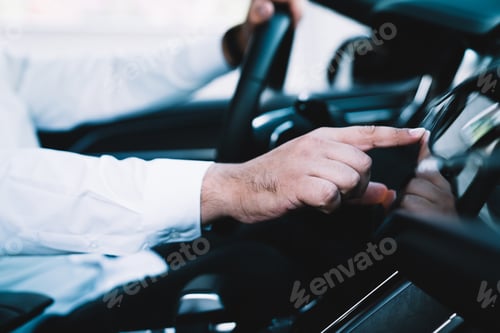 Preview: man driver checking location direction on automobile technology touching dashboard display for track