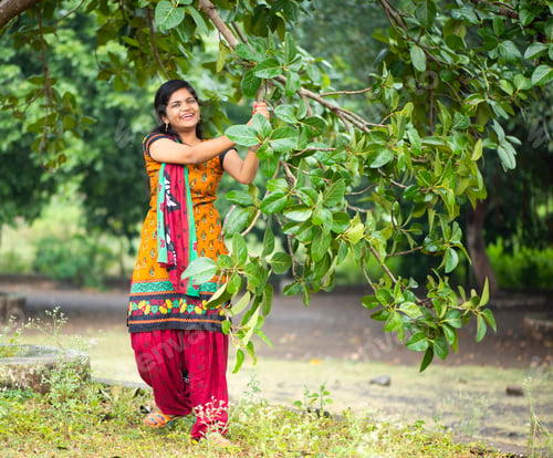 Preview: Beautiful girl between nature full of branches of tree.