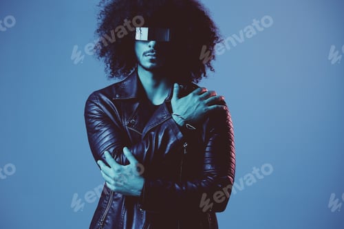 Preview: Portrait of fashion man with curly hair with stylish glasses on blue background multinational