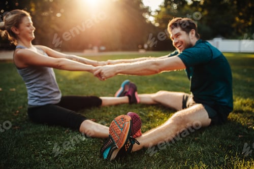 Preview: Young health couple doing stretching exercise