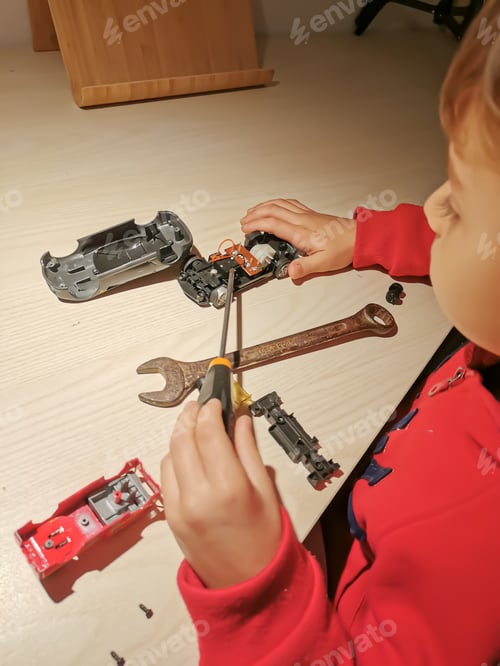 Preview: Little boy playing mechanic