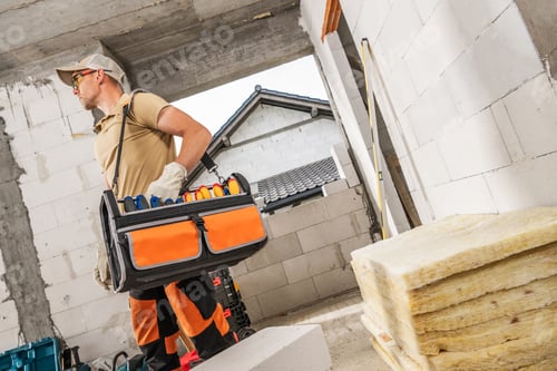 Preview: Professional Construction Worker with a Tool Box Hanged on His Shoulder
