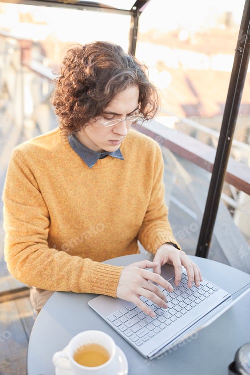 Preview: Man working on laptop