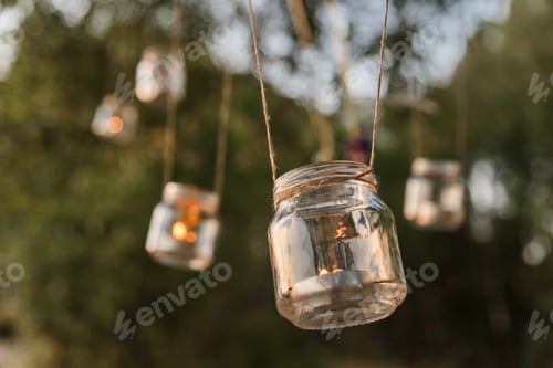 Preview: Mason jar candle hanging on tree for wedding decor