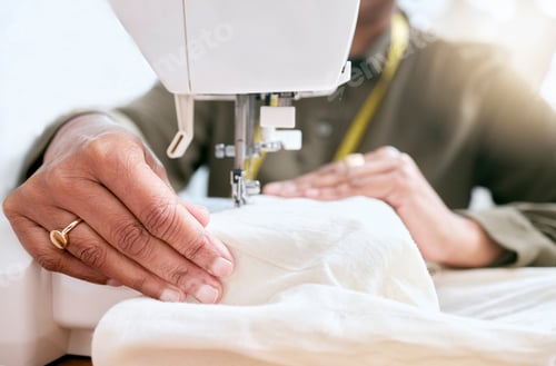 Preview: Tailor, woman hands and sewing machine for clothes fabric, luxury apparel or creative design in stu