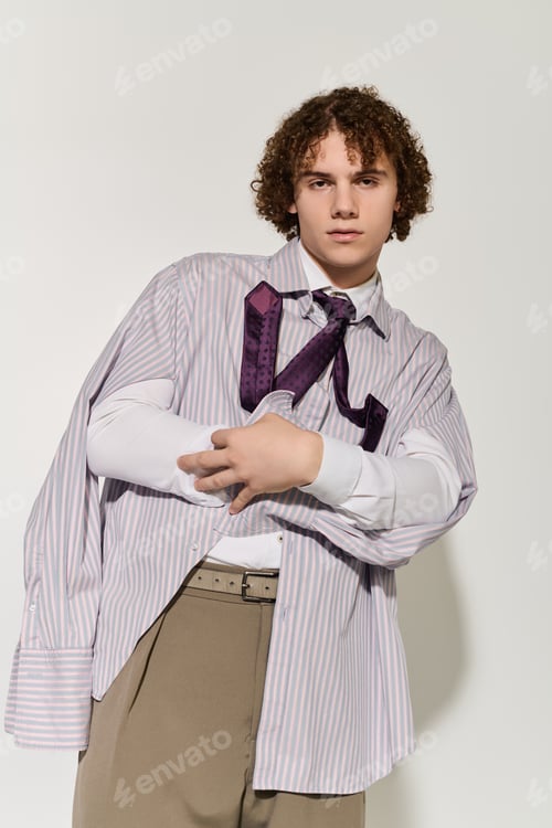 Preview: Stylish teenager confidently showcasing fashion and attitude in urban setting