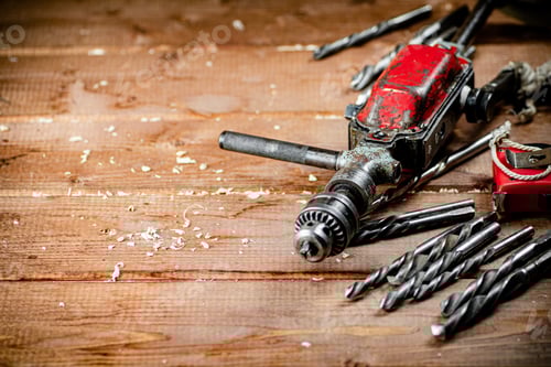 Preview: Vintage Drill and Bits on Wooden Surface