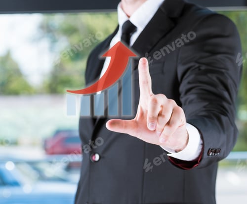 Preview: cropped view of businessman in black suit pointing with finger on diagram