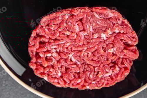Preview: Close-up of Red Ground Beef in Black Bowl