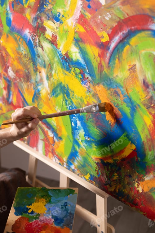 Preview: Artist working with painting. Man artist painter and palettte in creative studio