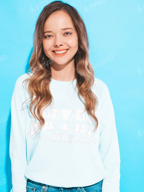 Preview: Portrait of young cute woman posing in studio