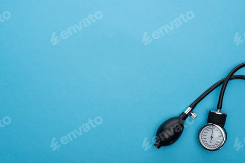 Preview: top view of sphygmomanometer on blue background