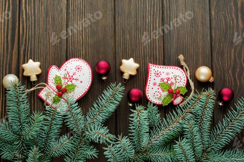 Preview: Christmas or New Year background. Fir-tree branches, different tree toys with Christmas ornament on