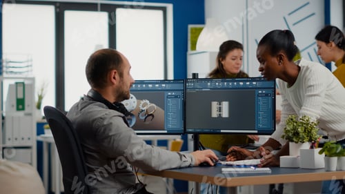 Preview: Black employee and project manager analysing mechanical metalic parts