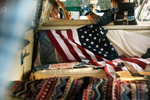 Preview: People Sitting in a Front Seat with American Flag on Rear Seat