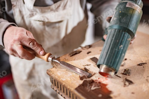 Preview: Male Carpenter Working On Old Wood In A Retro Vintage Workshop.