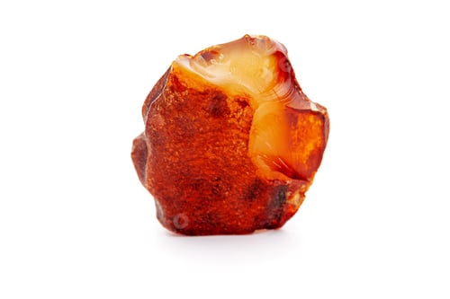 Preview: Natural amber. A piece of yellow opaque natural amber on white background