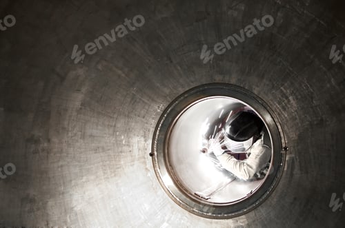 Preview: Welder or metal worker working inside a tunnel