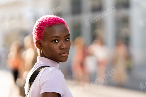 Preview: Portrait of a modern stylish young african woman outdoors