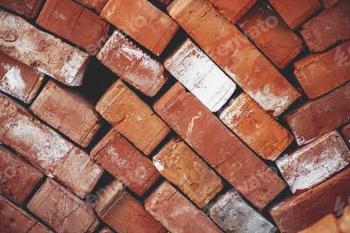 Preview: Stack of bricks close up. Process of house building and building materials concept. Brick wallpaper