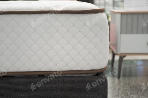 Preview: Premium mattress display in modern furniture store