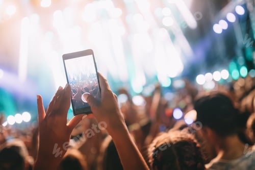 Preview: Portrait of happy crowd enjoying at music festival