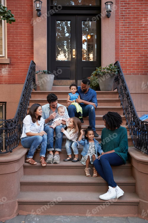Preview: Two families with kids sitting on front stoops, vertical