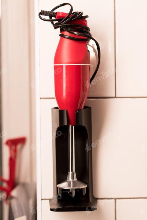 Preview: close up view of electrical blender hanging on wall