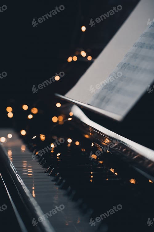 Preview: Piano keys over xmas lights closeup
