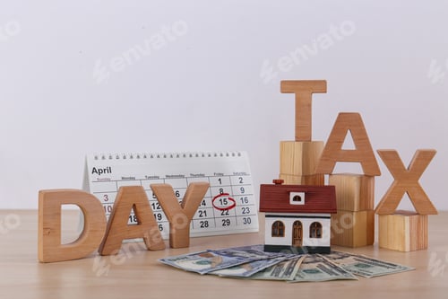 Preview: Phrase TAX DAY, wooden cubes, house model, calendar and money on table