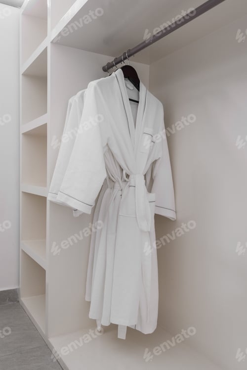 Preview: white bathrobe with wooden hangers in wardrobe