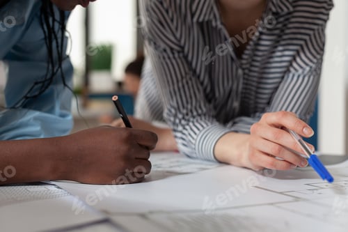 Preview: Close up of diverse architect women hands working