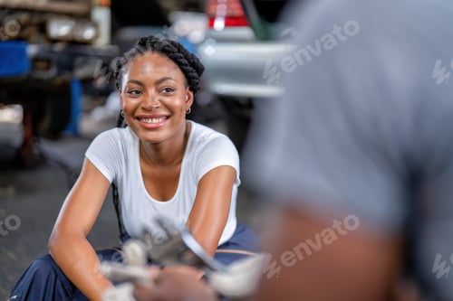 Preview: Mechanical guy at garage car repair shop sitting talking general topic