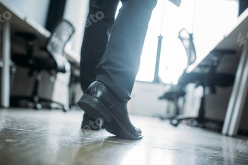 Preview: partial view of businessman walking in office