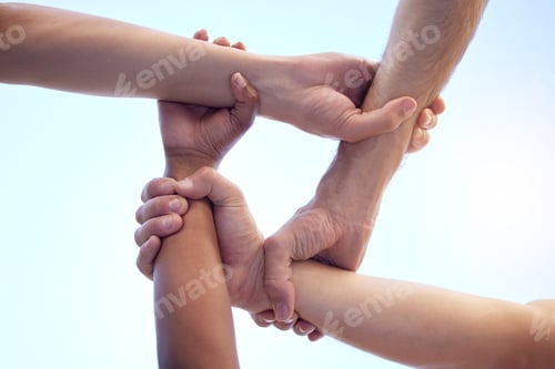Preview: No discrimination between our team. Shot of a group of diverse people with their arms interlinked.