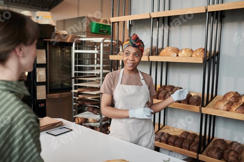 Preview: Woman selling the bread in the store