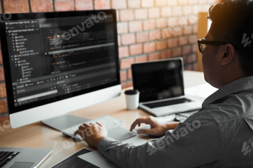 Preview: man working code program developer computer web development