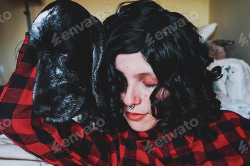 Preview: Cute shot of a young woman spending time with her dog