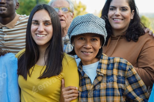 Preview: Crowd of multiracial people having fun together at city park