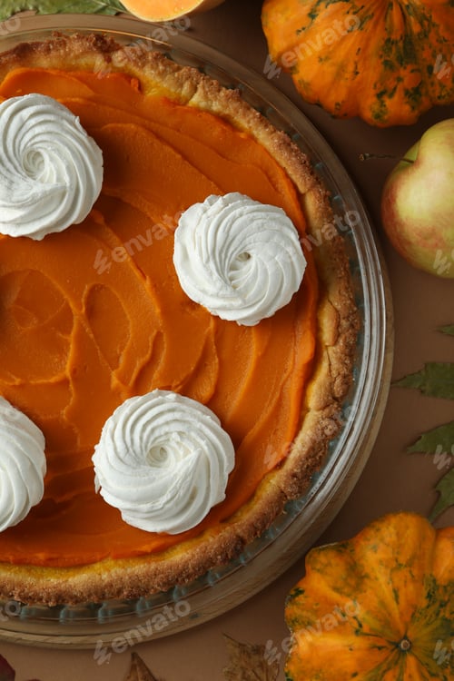 Preview: Concept of tasty food with pumpkin pie on beige background