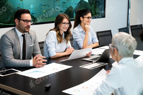 Preview: Business colleagues in conference meeting room during presentation