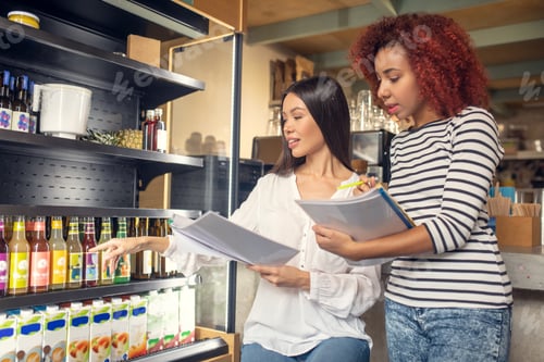 Preview: Young business partners owning cafeteria ordering drinks