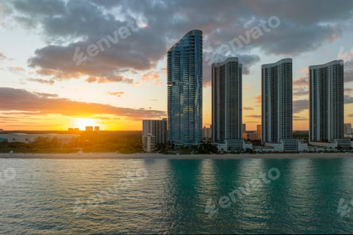 Preview: High angle view of Sunny Isles Beach city at sunset with expensive highrise hotels