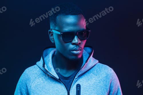 Preview: Portrait of stylish black man, wearing hoodie and sunglasses